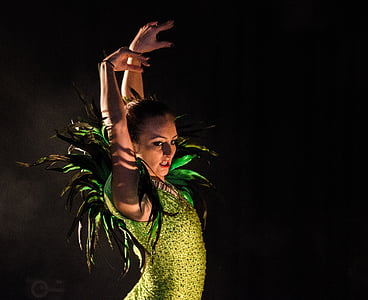 woman wearing green satin dress dancing thumbnail