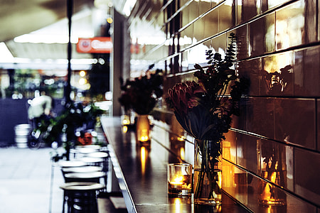 clear glass vase on brown table thumbnail