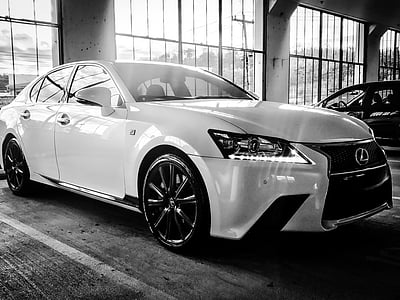white Lexus sedan inside building thumbnail