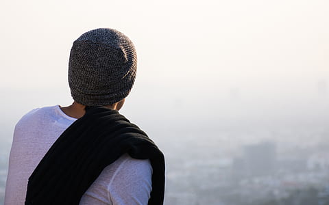 man wearing gray knit cap during daytime thumbnail