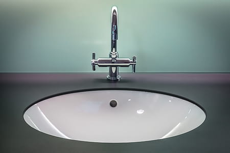 white ceramic sink with stainless steel faucet thumbnail