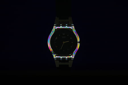 iridescent bezel watch against black background thumbnail
