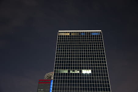 curtain wall building at night time thumbnail