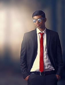 selective focus photography of person in suit thumbnail