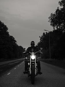 Grayscale Photo of Man Riding Motorcycle on the Road thumbnail