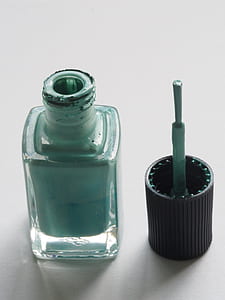 Shallow Focus Photography of Teal Nail Lacquer thumbnail