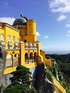 yellow concrete castle on mountain thumbnail