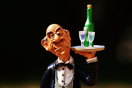 man holding wine bottle figure in shallow focus photography thumbnail