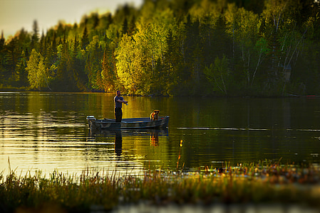 man and dog on boat thumbnail