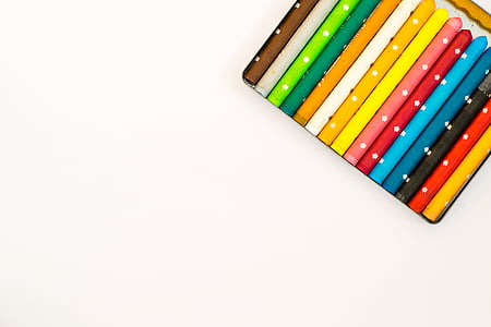two brown and yellow cue sticks thumbnail
