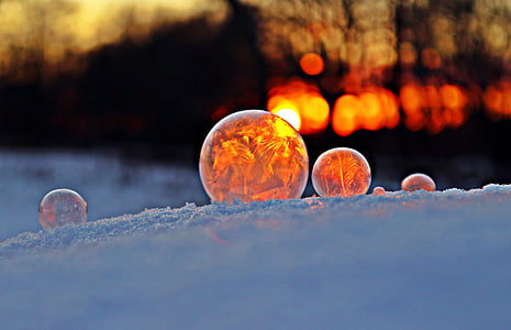 selective focus photography of three balls on white surface thumbnail