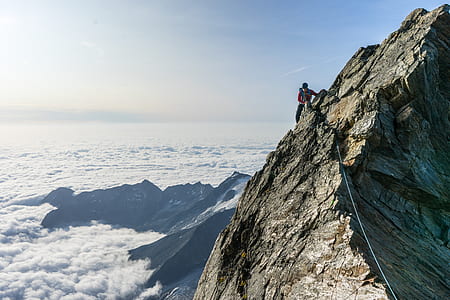 birds eye view of a person on mountain cliff thumbnail