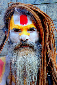 man with face paint in close-up photography thumbnail