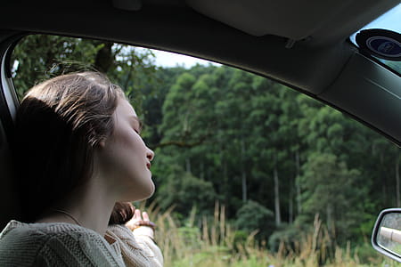 Woman in White Top Inside Vehicle thumbnail