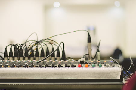 Black Electronic Device on White and Brown Table thumbnail