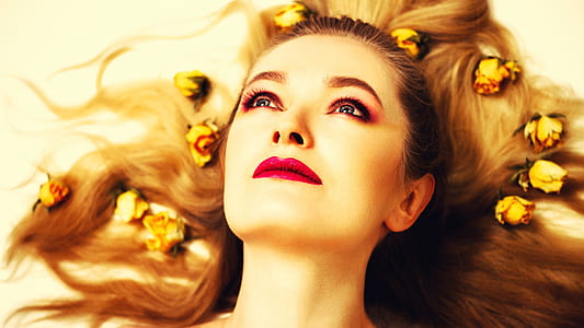 woman laying down with yellow roses on hair thumbnail