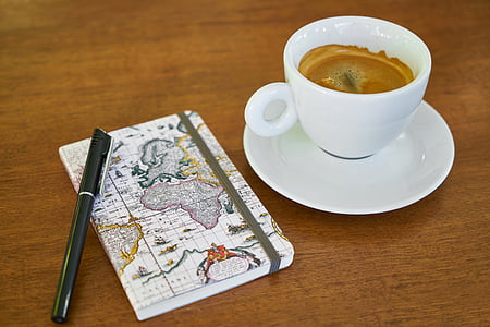 white ceramic mug on white saucer thumbnail