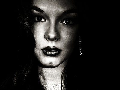 woman black-haired wearing silver-colored hook earring thumbnail