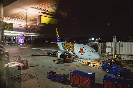 white and yellow airplane on concrete surface thumbnail