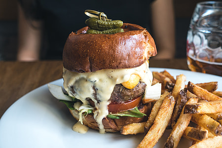 Tiny pickles on top of burger thumbnail