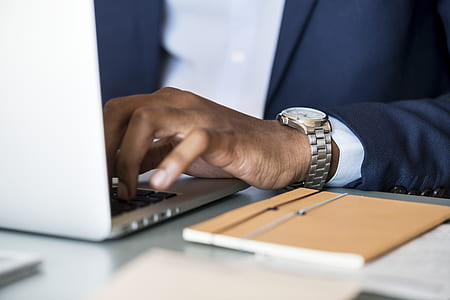 person using laptop on tabletop thumbnail