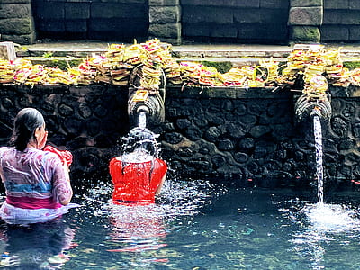 two women's taking a bath on river thumbnail