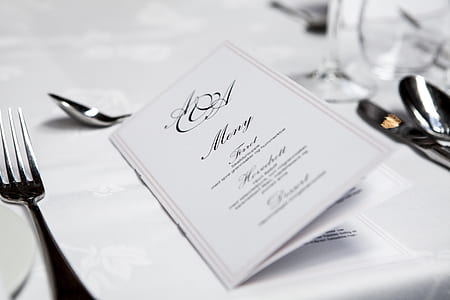 white menu book on white table thumbnail