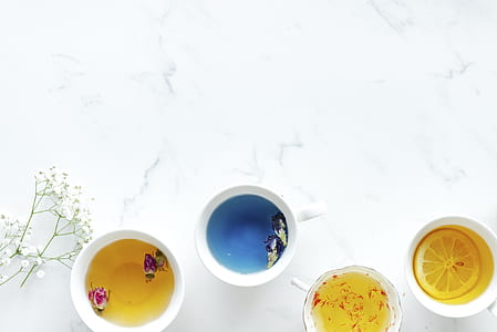 four assorted juices in cups thumbnail