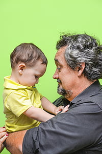 man carrying baby thumbnail