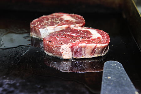 two sliced meats on griddle thumbnail