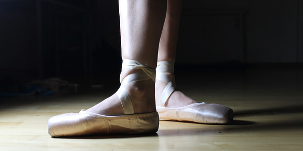 woman wearing pair of gray Ballet shoes thumbnail