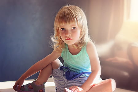 girl wearing green tank top and gray pants thumbnail