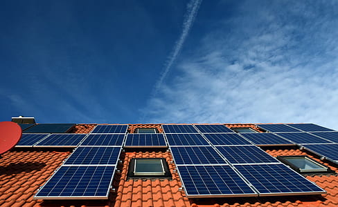 blue solar panels mounted on roof thumbnail