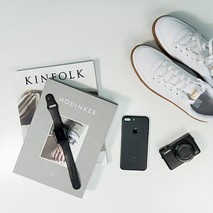pair of white Puma sneakers beside black iPhone 7 and Apple Watch thumbnail