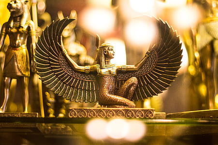Egyptian deity figurine close-up photography thumbnail