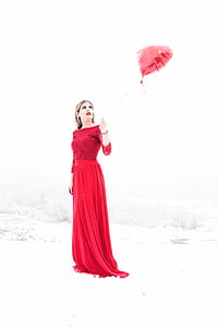 woman holding red balloon thumbnail