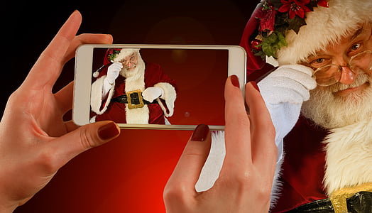 person taking picture of Santa Claus thumbnail