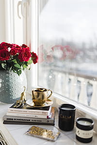 Gold cup of coffee and red roses bouqet thumbnail