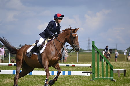 man riding horse during daytime thumbnail
