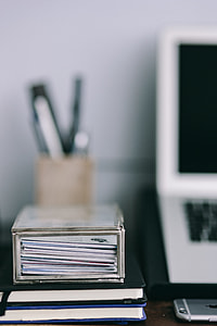 Elegant workspace with Macbook, iPhone, business cards and notebooks thumbnail