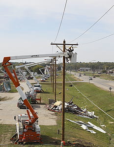 people working on electric poles during daytime thumbnail