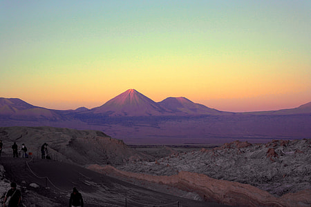 Landscape shot of mountains in the distance at sunset thumbnail