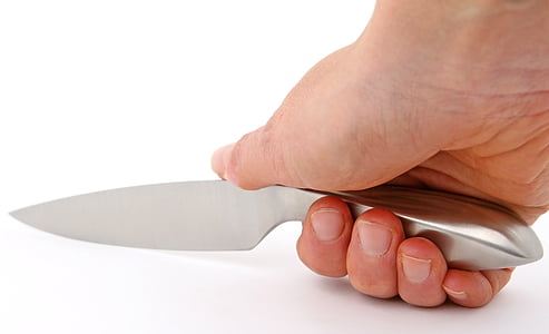 person holding gray knife thumbnail