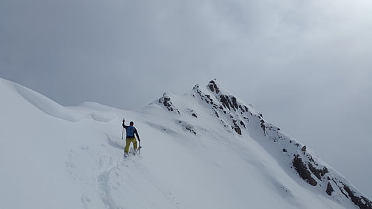 man skiing on snow covered mountain thumbnail