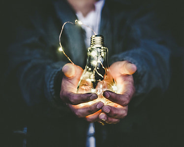 person holding light bulb turned on thumbnail