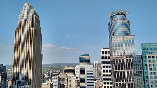 brown concrete building under blue and white sky at daytime photo thumbnail