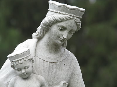 woman carrying her baby statuette thumbnail