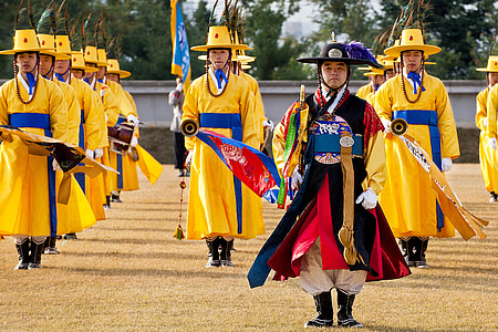group of men performing on open fields thumbnail