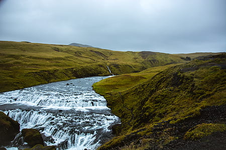 body of water between mountain thumbnail