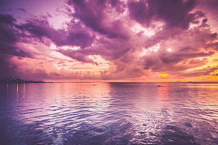 body of water photo during sunset thumbnail
